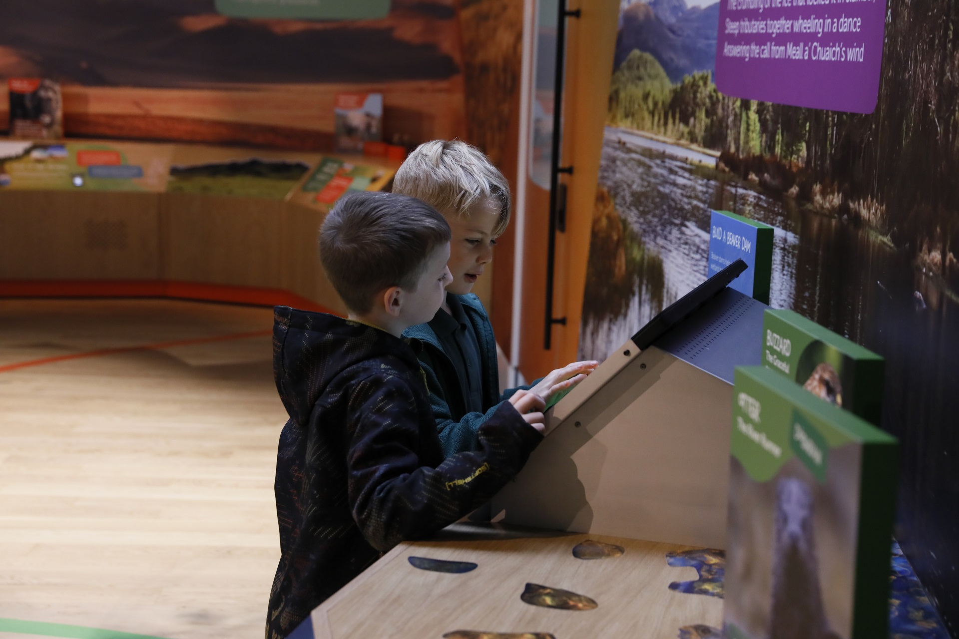 Two children playing an interactive game inside Scotland's WIldlife Discovery Centre

IMAGE: Laura Moore 2024