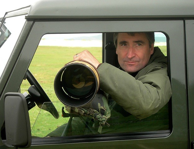 laurie campbell with camera out of jeep window nature photography workshops