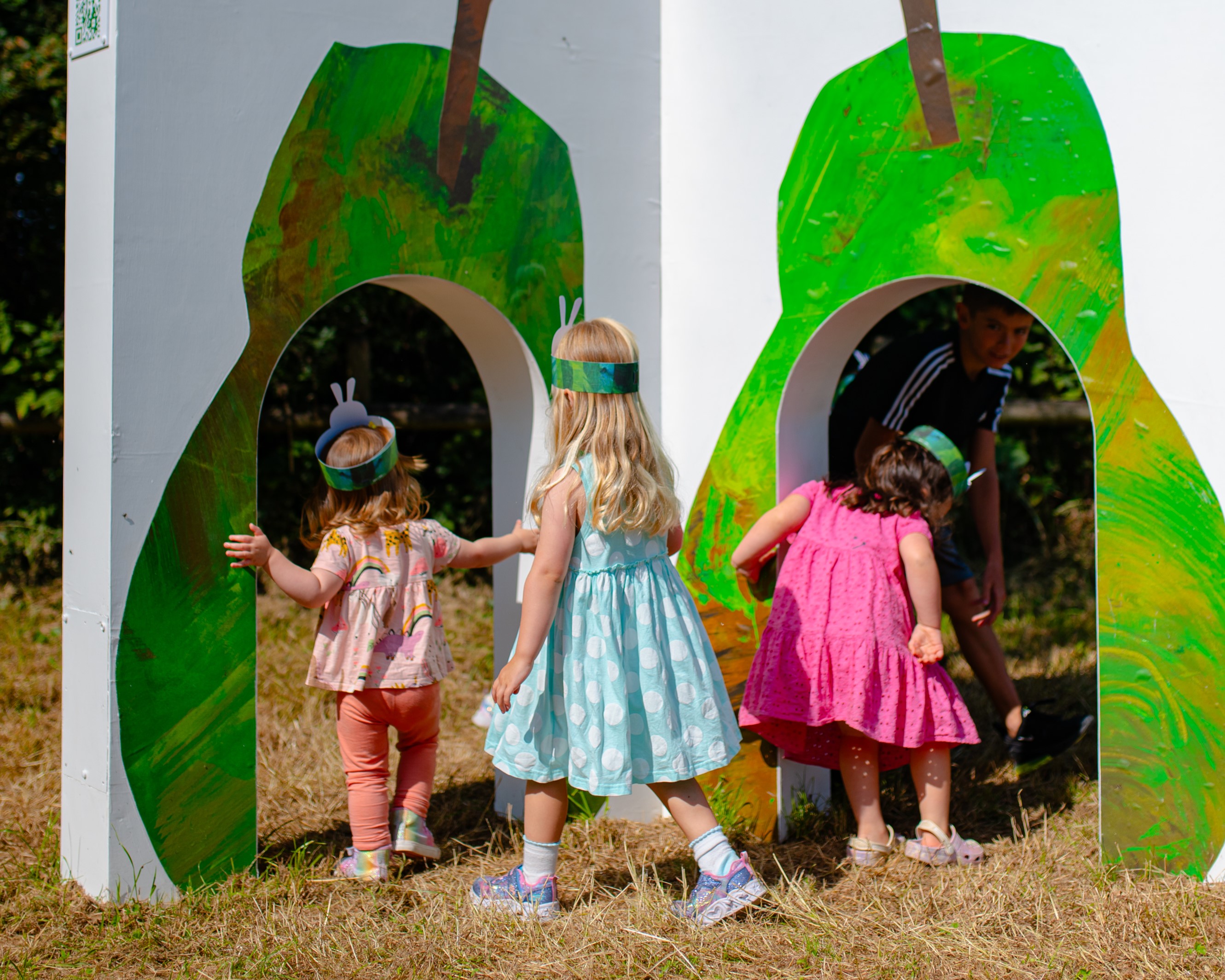 children exploring through storybook at very hungry caterpillar trail